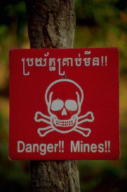 Warning sign which reads - "Danger!! Mines!!"