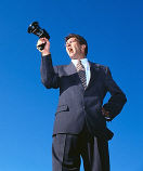Image of a man in a suit with a megaphone